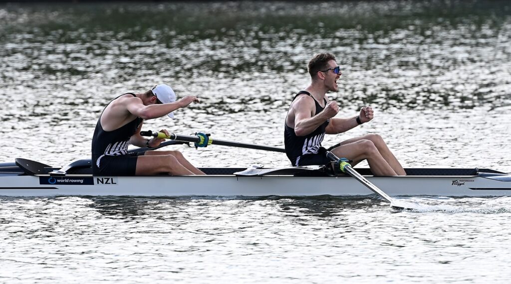 Two rowers celebrating at the end of a race