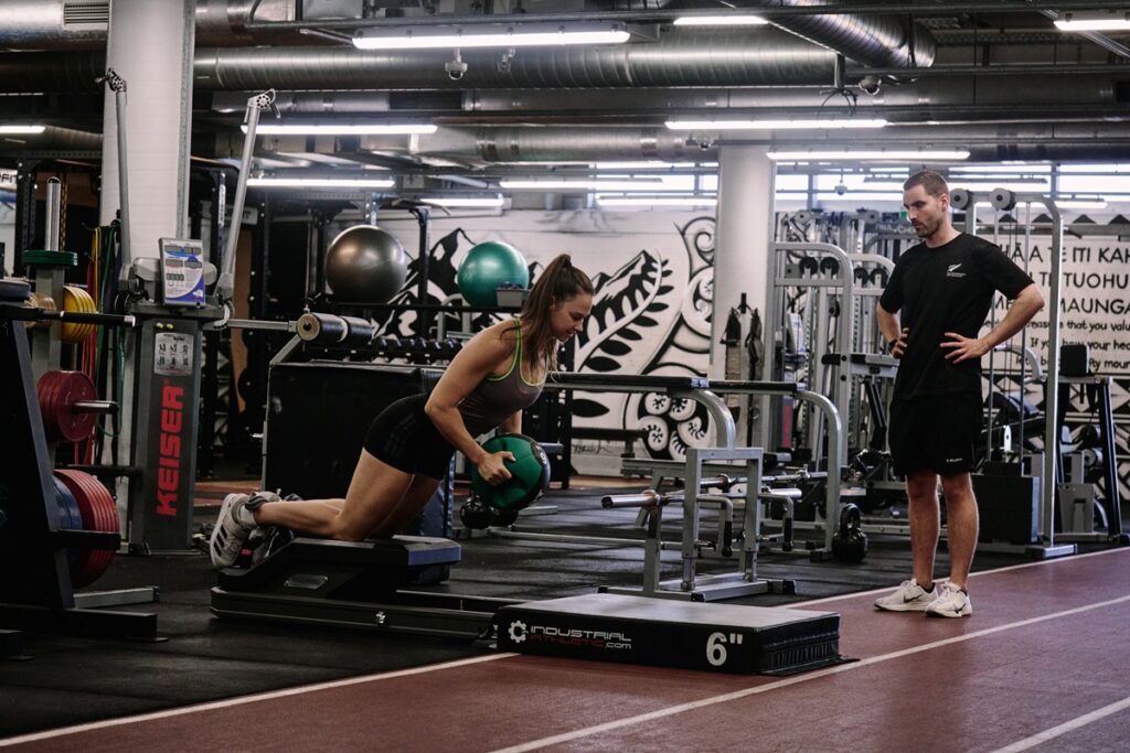 Athlete and coach in the HP gym