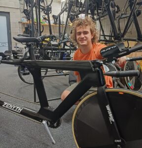Ben Westernberg sitting behind his bike
