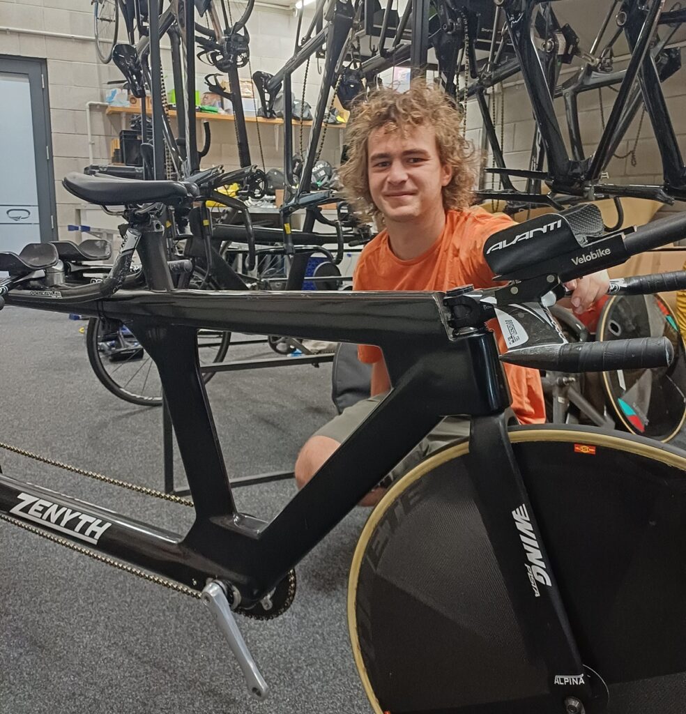 Ben Westernberg sitting behind his bike