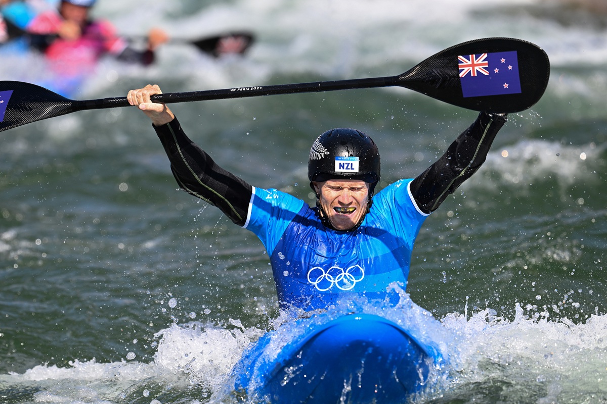 Finn Butcher of New Zealand celebrates winning gold in the Men's Kayak Cross final at Nautical St - White Water, Paris, France on Monday 5 August 2024.