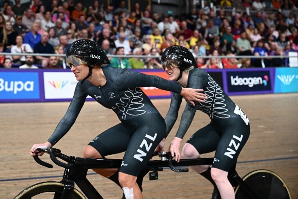 Two athletes on a tendem bike